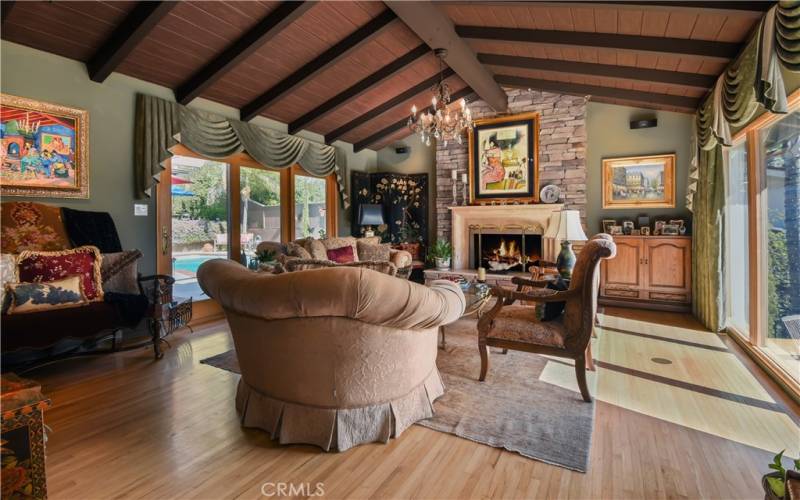 Large living room with an Italian imported fireplace hearth and beamed ceilings