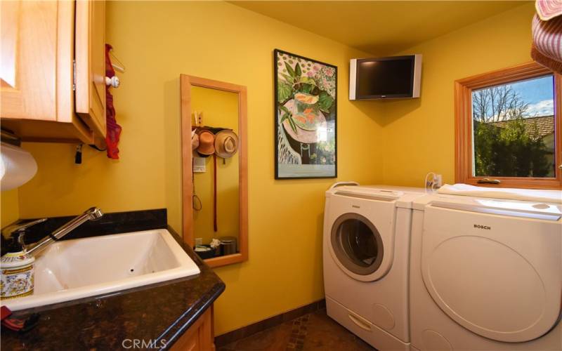 Separate laundry room sink and storage!