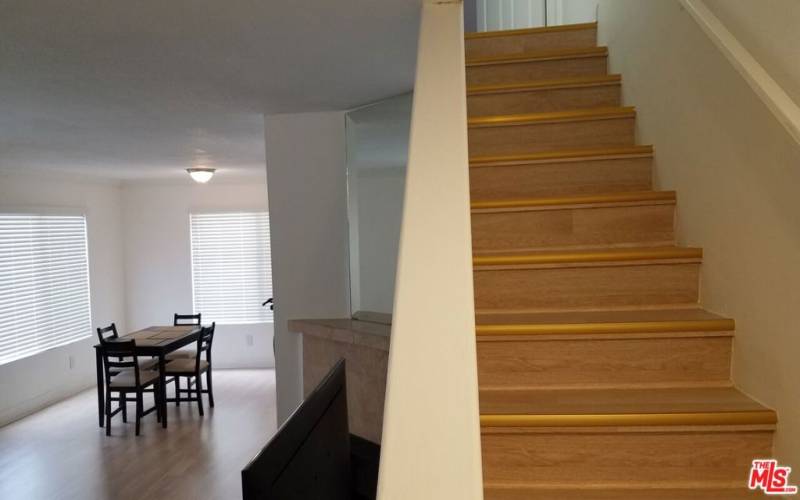 Stairs next to living room