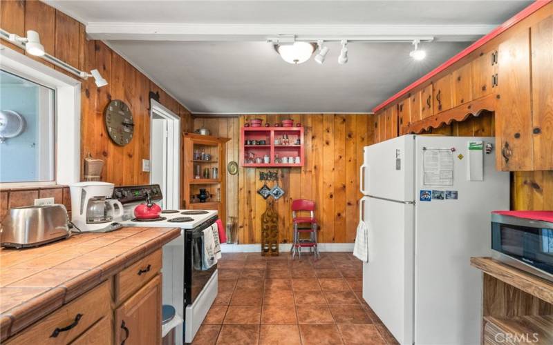 Refrigerator and small appliances included.  Tile flooring for easy cleanup.