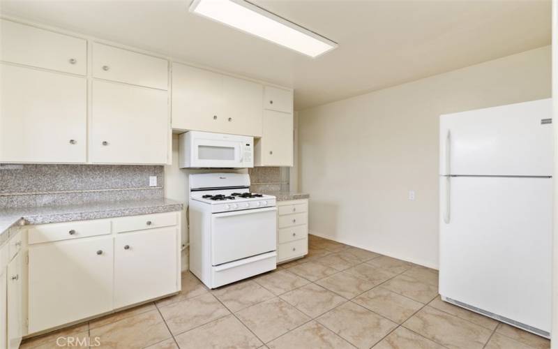 Kitchen comes with free standing range, fridge and dishwasher
