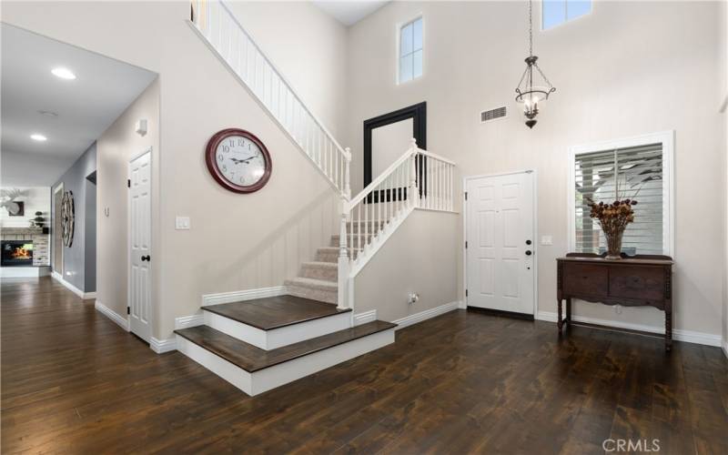 Hallway leading into Family Room. Foyer and Stairs to 2nd level