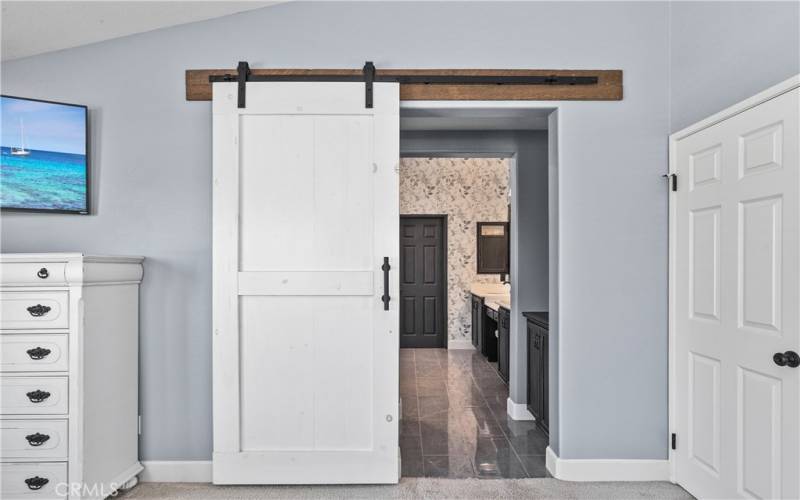 Barn Door leading into Primary Bathroom