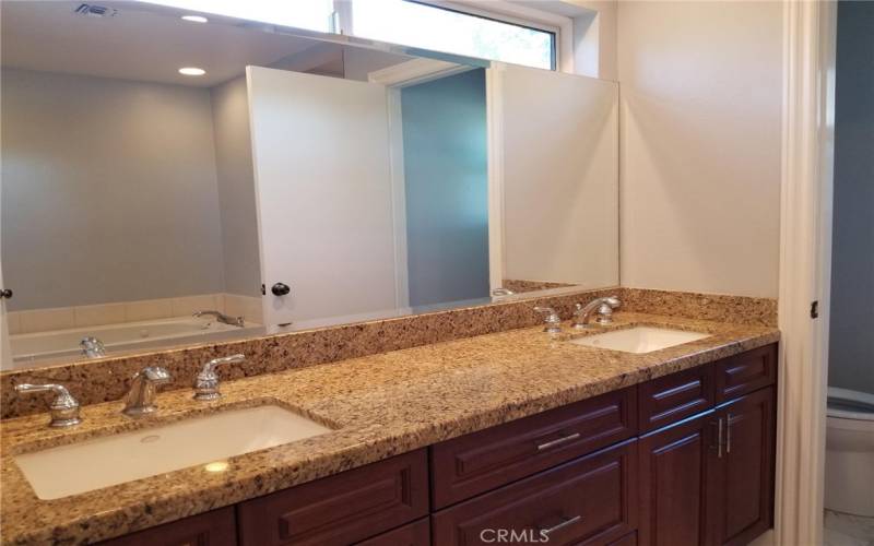 Granite counter vanity with lots of cabinet space