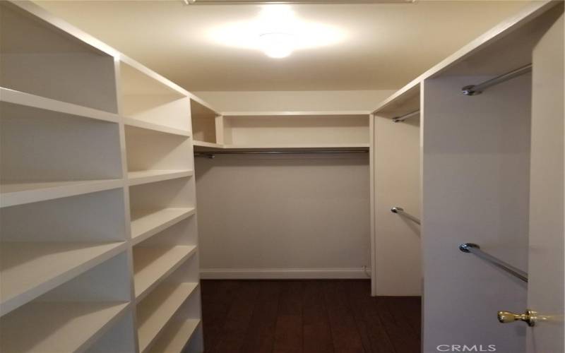Master walk in closet with organizers and lots of room