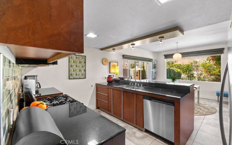 The kitchen offers elegant black granite countertops, stainless appliances and plenty of cabinet space.