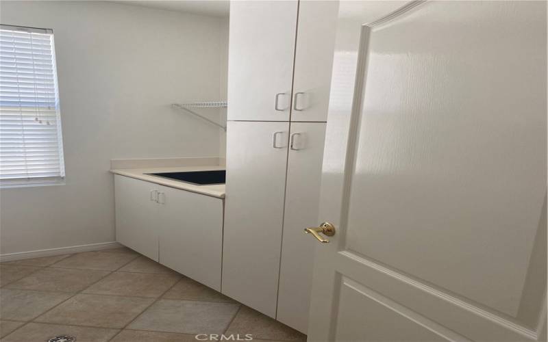 Laundry room storage and stainless sink