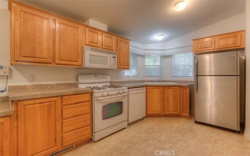 Propane range, microwave hood , a dishwasher, & stainless refrigerator included.