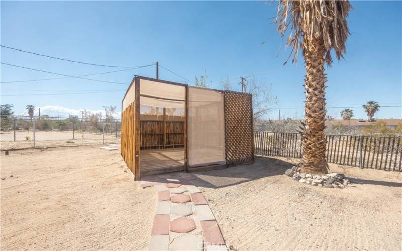 Wood shade structure in backyard