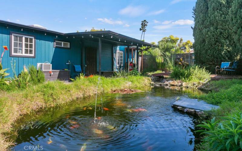 Relax in the backyard next to your very own koi pond.