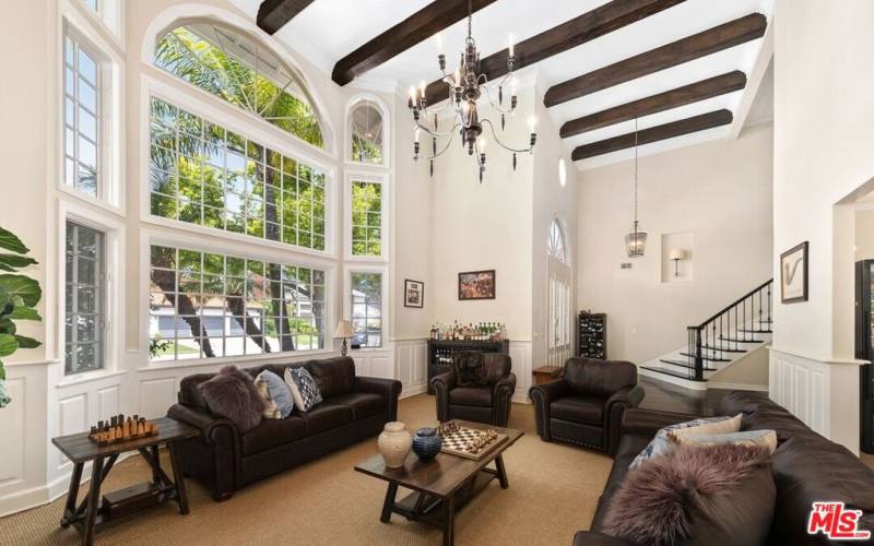 Living room with high ceilings and beautiful beams.