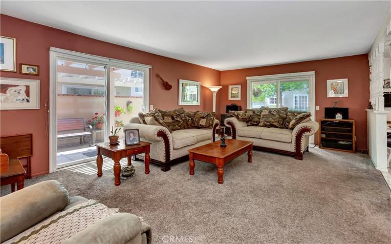 Another view of the lovely living room with two dual Paine slider doors leading to the side and rear yard.