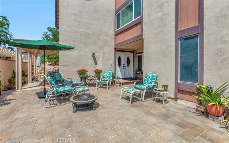 Another view of the courtyard and double entry front doors.