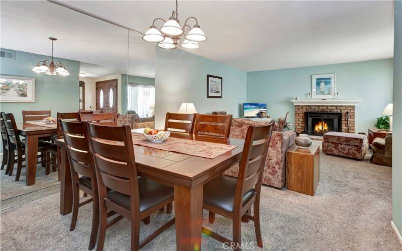 Dining room and family room with fireplace.