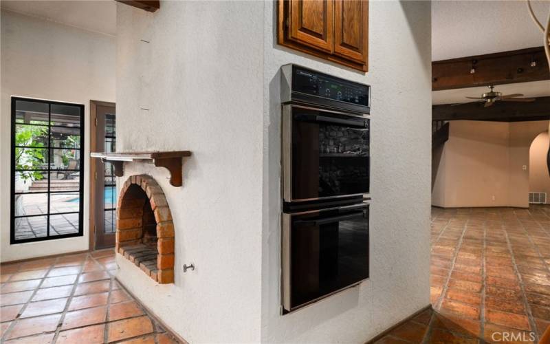 Kitchen wall ovens and fireplace