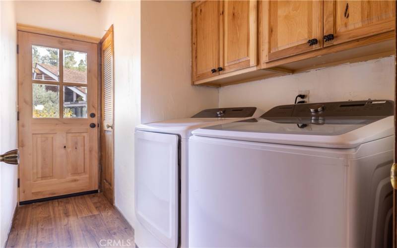 Separate laundry room/mud room with access too side deck.