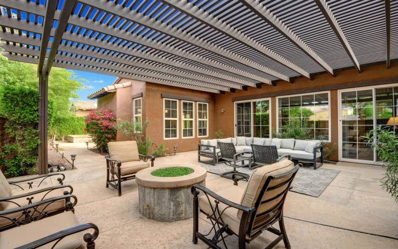 SIDFE TRELISSED PATIO WITH FIRE PIT MLS