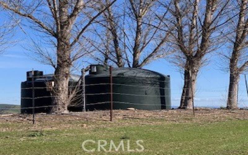Two 5,000 gallon water tanks