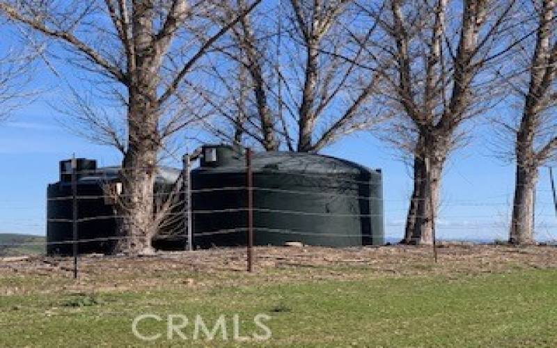 Two 5,000 gallon water tanks