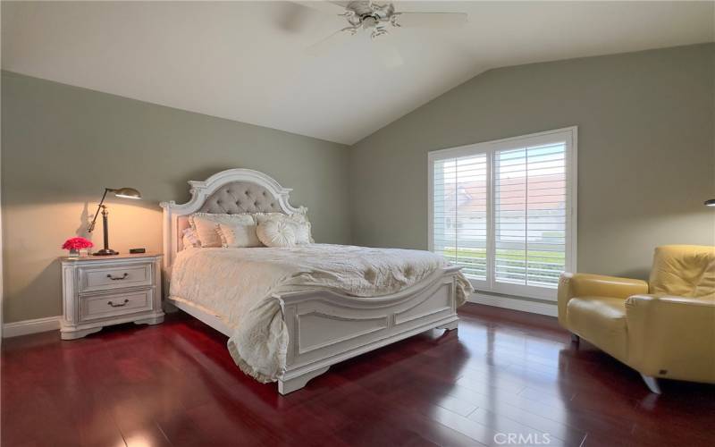 Spacious Master Bedroom with Ceiling Fan, Laminate Wood Flooring, Newer Window with Shutters