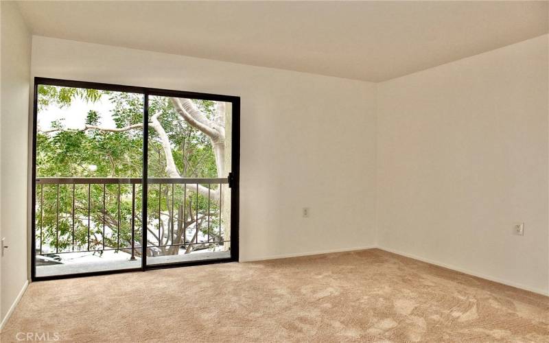 With being an end unit, this bedroom has lots of light and a nice view looking out plus a balcony