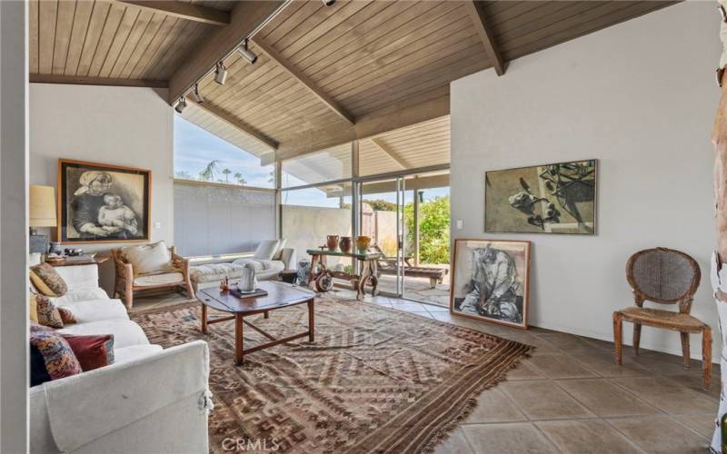 Open Family Room with lots of natural light and high wooden ceilings