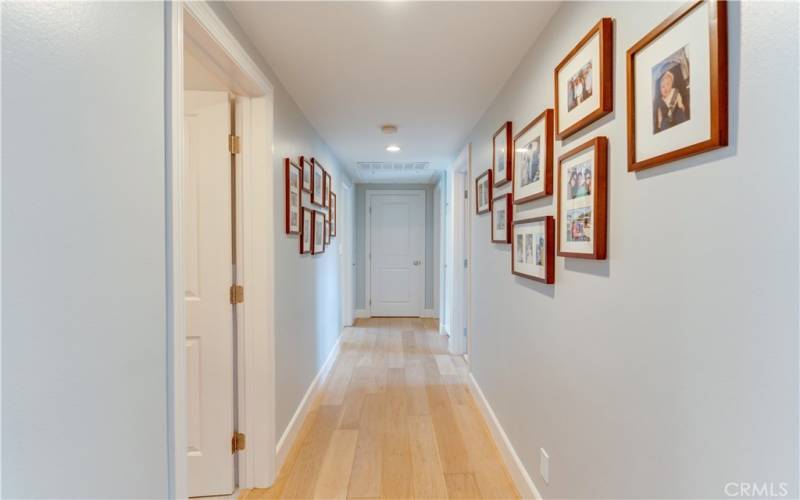 Right wing hallway features master suite, 2 bedrooms, and full bath
