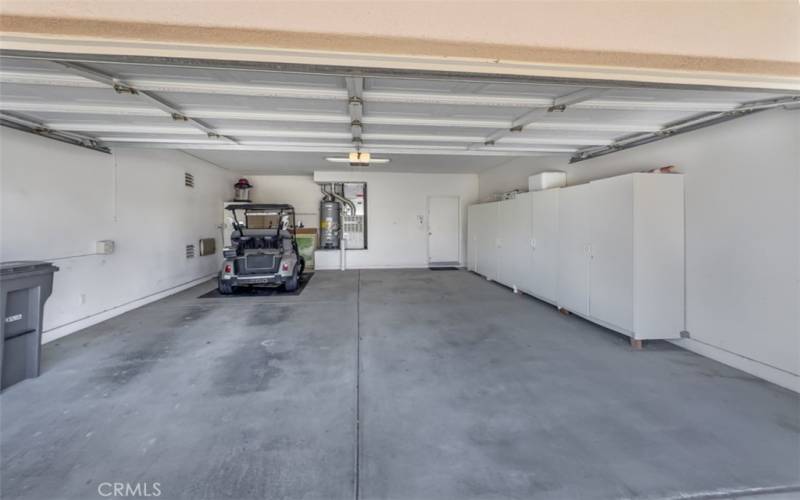 Two Car garage with tons of storage and a EZ-GO Custom Golf Cart