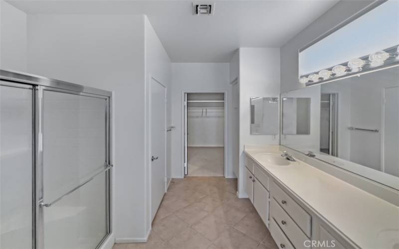 Large master bathroom with a large walk-in closet