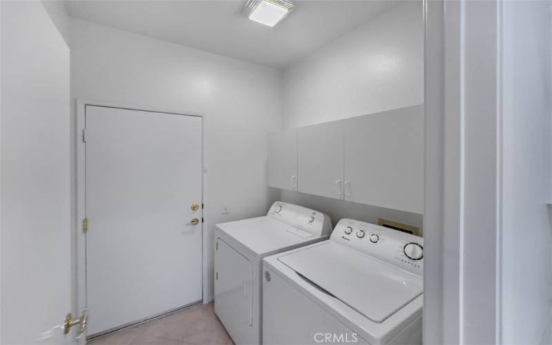 Inside laundry room with Utility storage with direct access to garage