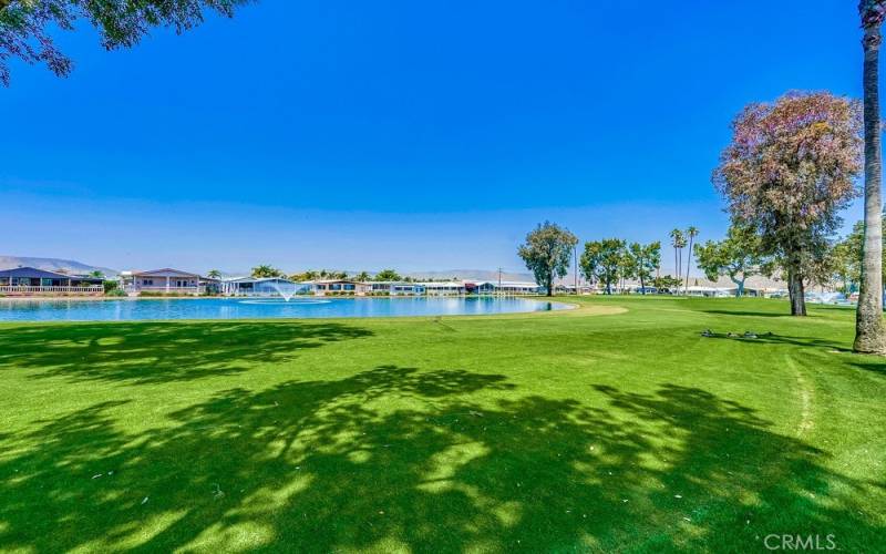 backyard view of golf course, mountains and pond