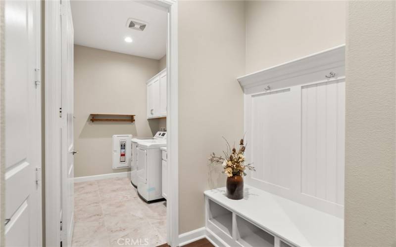 The laundry room is large and spacious - and right as you enter the home from the garage you have a beautiful built in land spot for shoes, purses, etc.