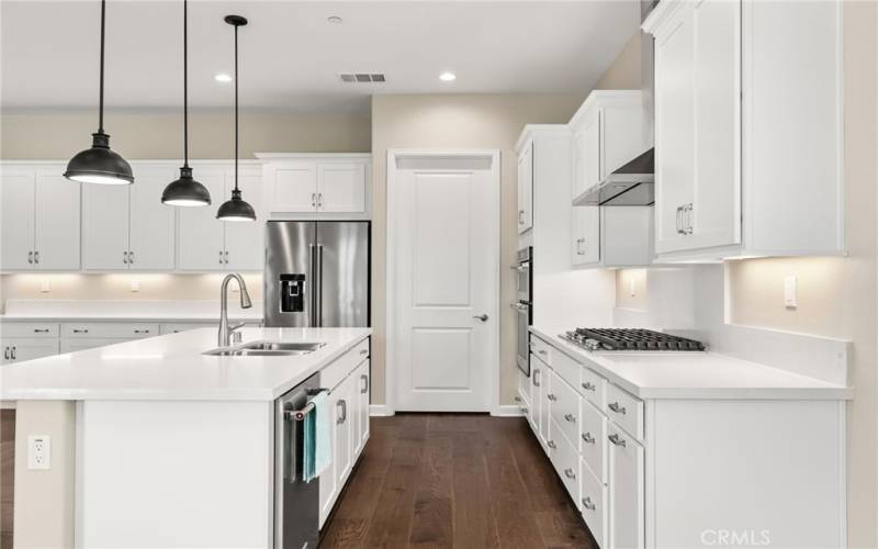 Need storage? Extensive white cabinetry and a large walk in pantry is perfect for storage!