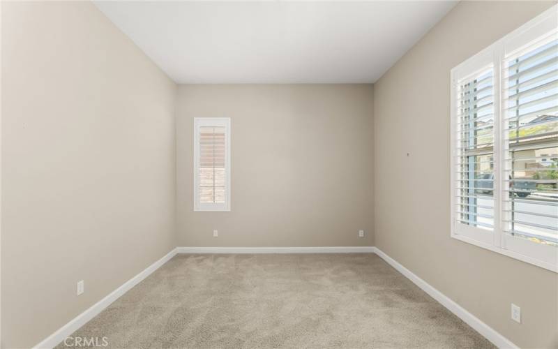 This guest room is large and separate from the master and the rest of the home with a secondary bathroom close by.