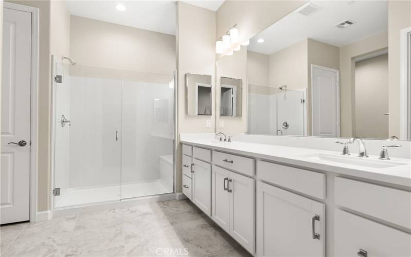 This master bathroom is large and spacious with a huge walk in shower. Plus it is private from the master bedroom so if someone is resting in the master bedroom, they won't be disturbed.
