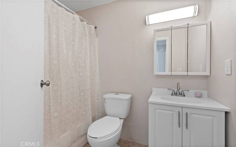 Full Bathroom with tub and shower in hallway