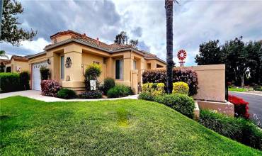  Front of home, on corner lot,  with side patio area.