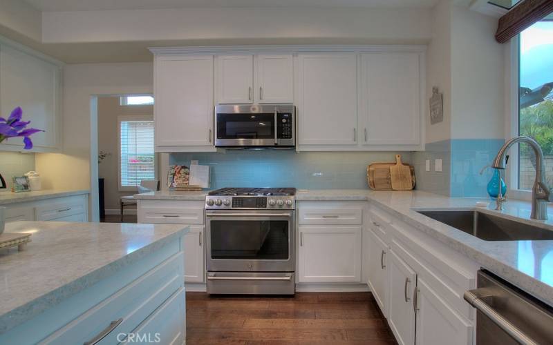 Enjoy this remodeled Kitchen with granite counters and stainless steel appliances