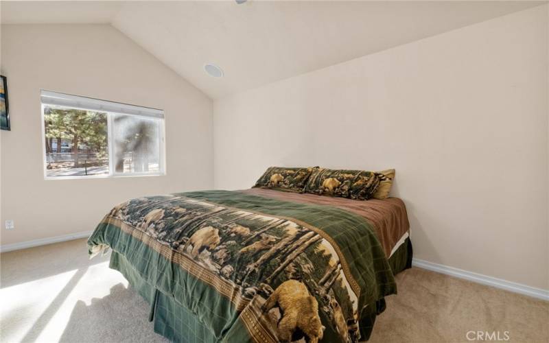 Primary bedroom, separate from guest rooms, directly off great room