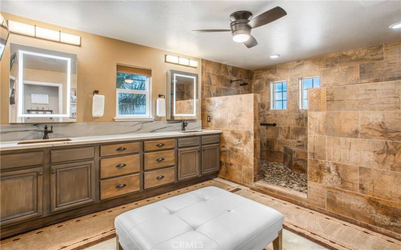 Incredible primary bathroom with stunning views out of those shower windows!