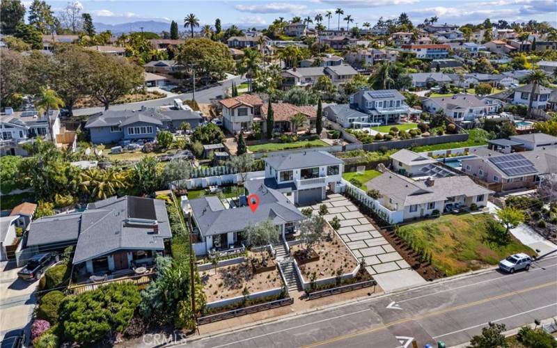 Homes sit on the largest elevated lot on Donna Drive with panoramic ocean views