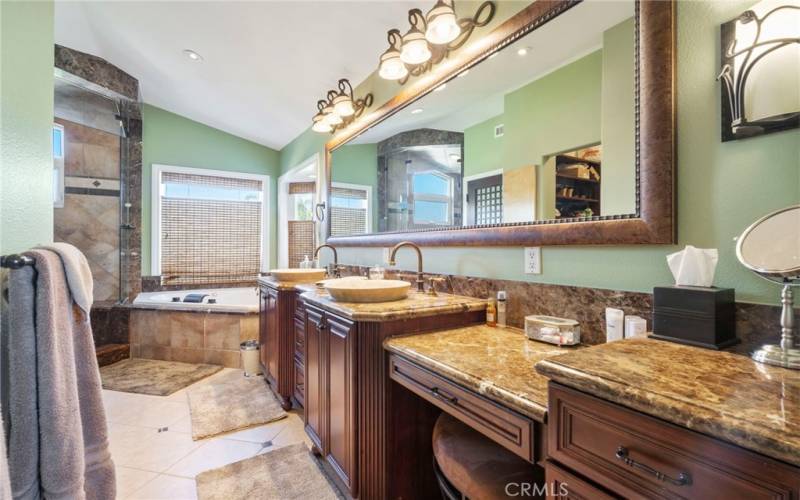 Primary Bath, Jetted tub, double sinks, walk in closets with storage systems, stone countertops