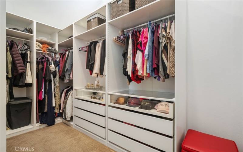 Primary Bedroom Closet storage system - one of two walk in closets