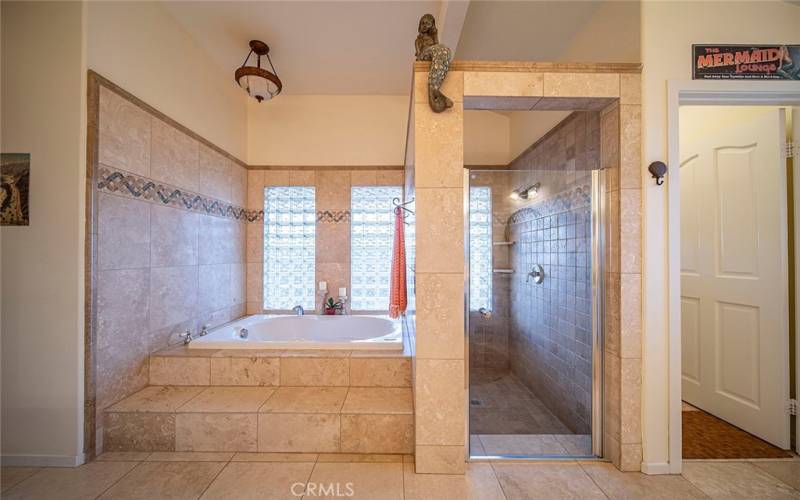 Primary bath...separate tub & shower and privacy door for commode