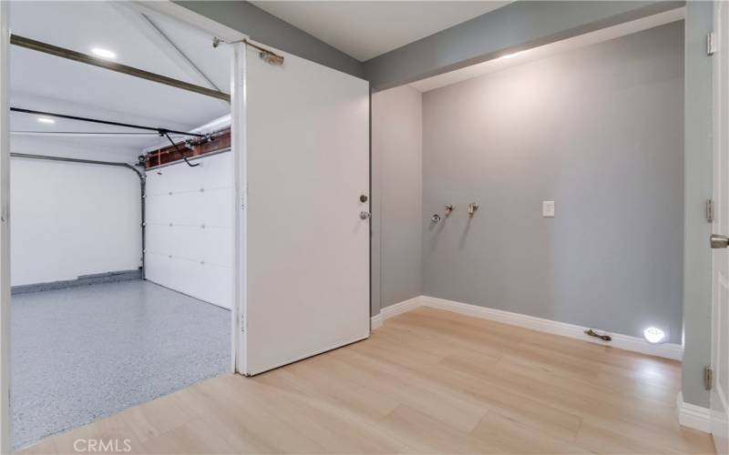 Laundry enclave and garage access door
