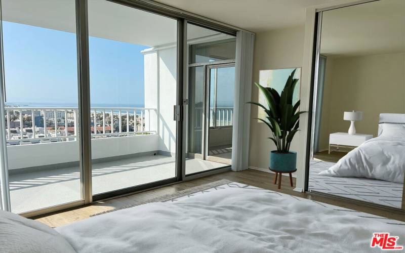 Bedroom leads to balcony overlooking the ocean