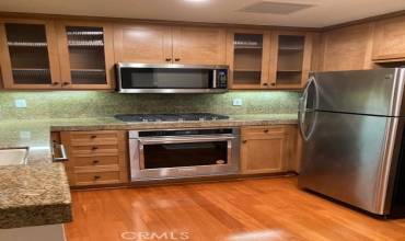 Note your granite counters, stainless appliances installed 2022 plus refrigerator is included. You'll love the glass fronted cabinets.