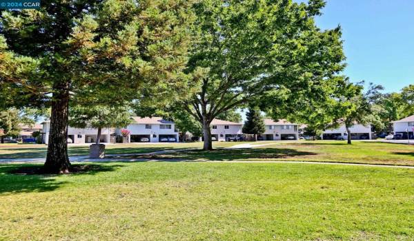 Surrounded by walking trail, adjacent to community pool.