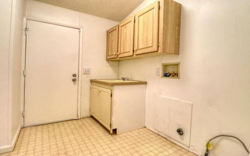 Laundry room attached to garage