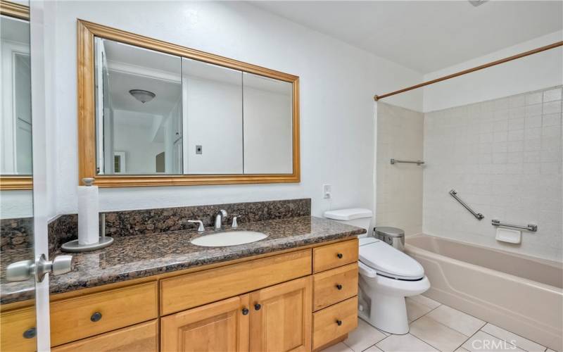 Lovely remodeled bath with granite counters & newer cabinetry